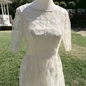 White dress with lace by Adrianna Papell